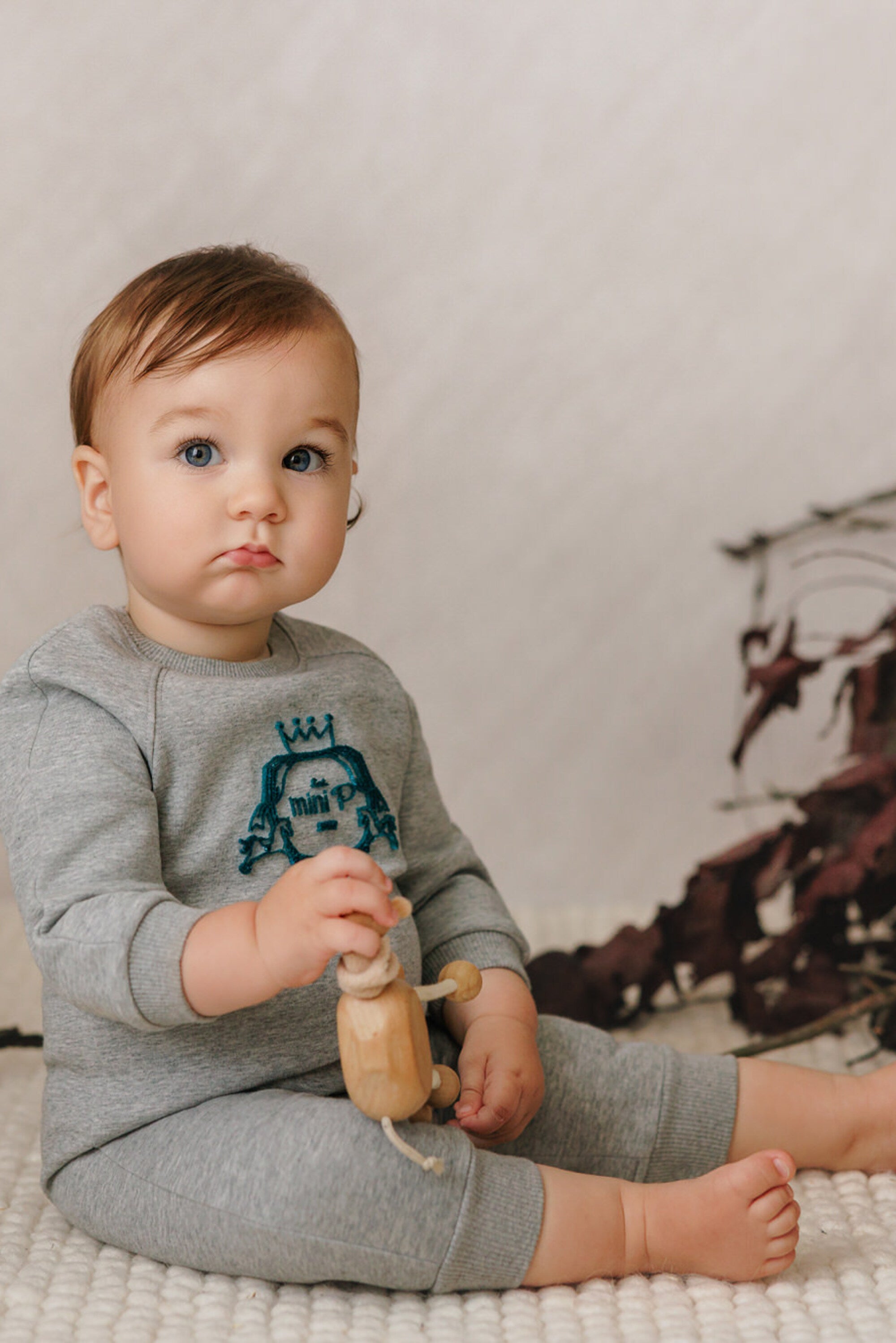 VELVET EMBLEM ONESIE